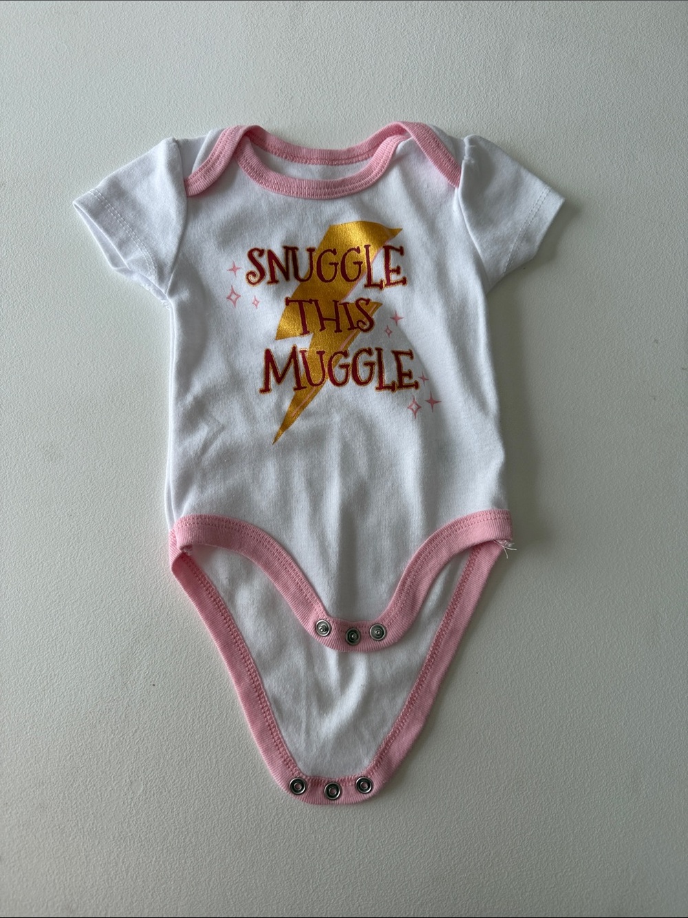 Warner Bros. - White & Pink "Snuggle This Muggle" Bodysuit with Gold Lightning